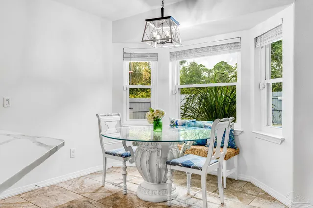 a view of a dining room with furniture window and outside view