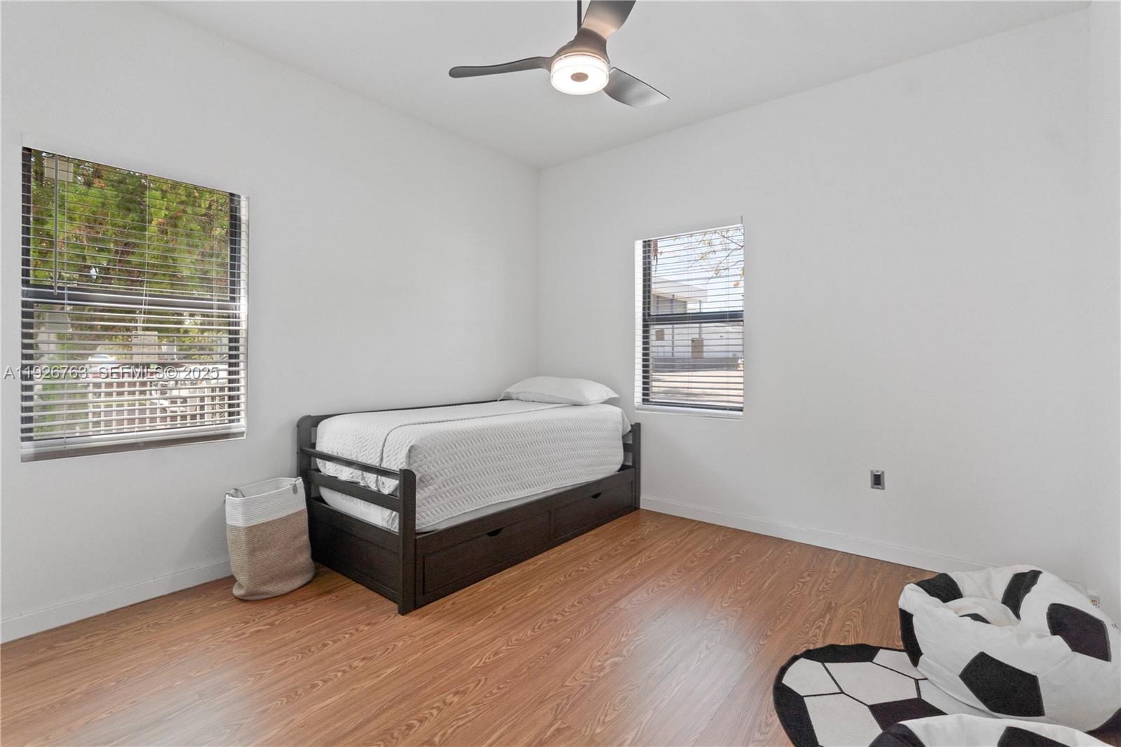 601 Southwest 1st Street Hallandale Beach, FL 33009 - Photo 19 of 33 a bedroom with a bed and window