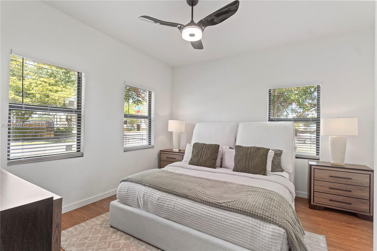 601 Southwest 1st Street Hallandale Beach, FL 33009 - Photo 23 of 33 a bedroom with bed cabinets and window