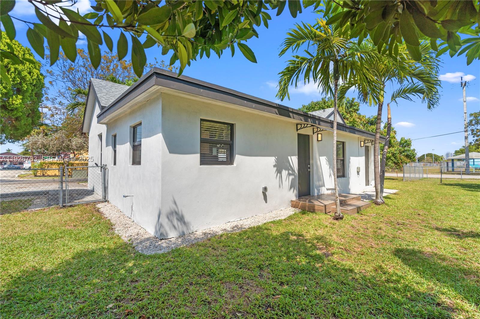 601 Southwest 1st Street Hallandale Beach, FL 33009 - Photo 28 of 33 a view of a house with a yard