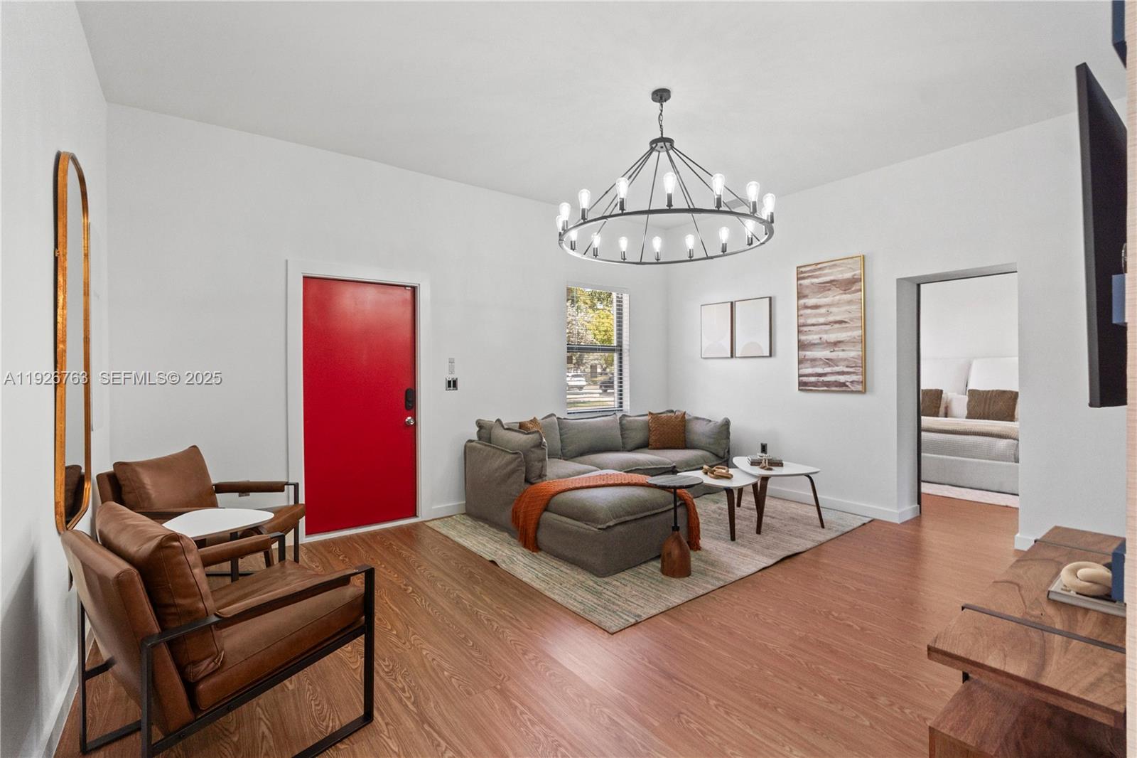 601 Southwest 1st Street Hallandale Beach, FL 33009 - Photo 4 of 33 a living room with furniture chandelier and a dining table