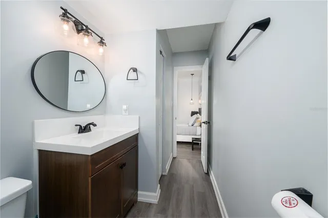 a bathroom with a sink and a mirror