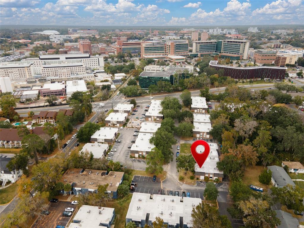 1700 Southwest 16th Court, Unit C25 Gainesville, FL 32608 - Photo 18 of 22 an aerial view of residential building and parking space