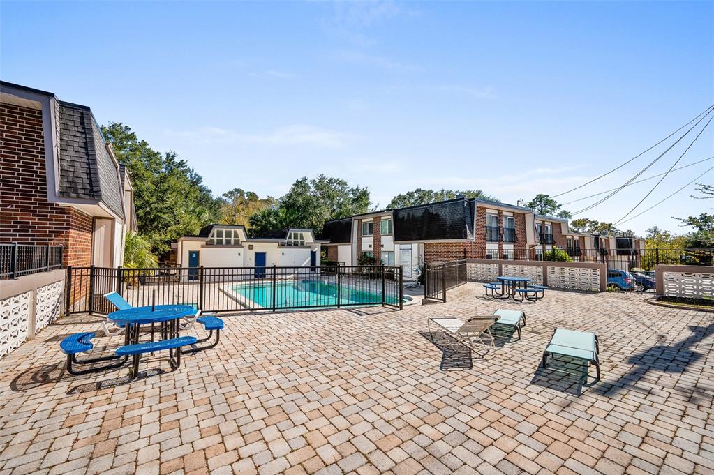 1700 Southwest 16th Court, Unit C25 Gainesville, FL 32608 - Photo 21 of 22 a view of a terrace with chairs