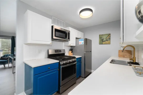 a kitchen with a stove and a microwave