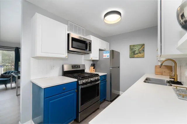 a kitchen with a stove and a microwave