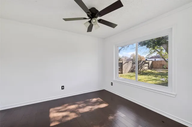 a view of a room with wooden floor and closet