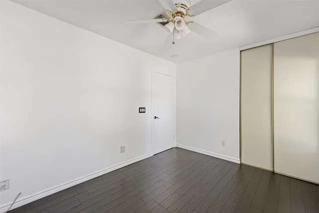 a view of room with window and hardwood floor