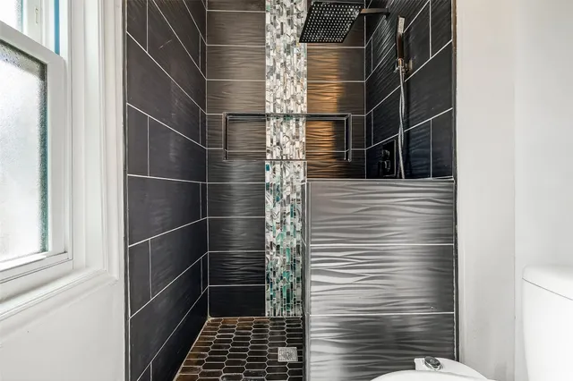 a view of backyard with wooden fence