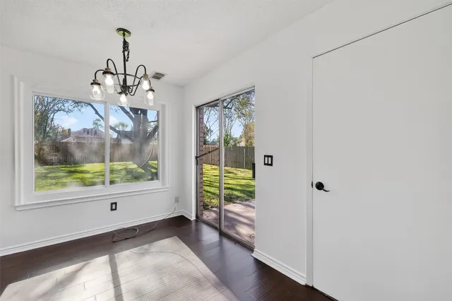 a kitchen with a refrigerator and a stove