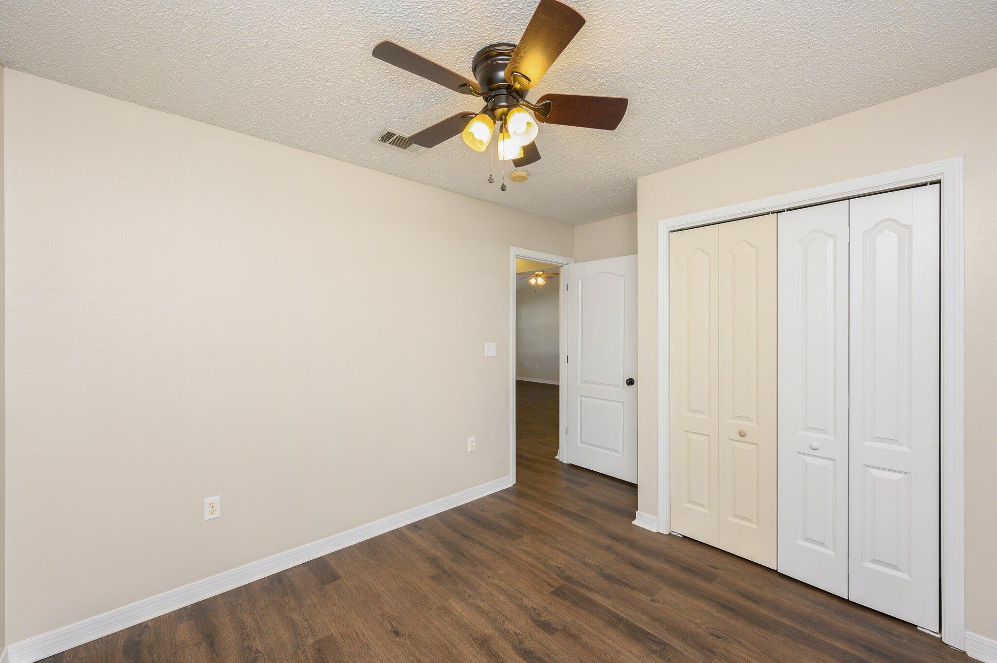 502 Hyde Park Drive Crestview, FL 32539 - Photo 19 of 35 wooden floor in an empty room