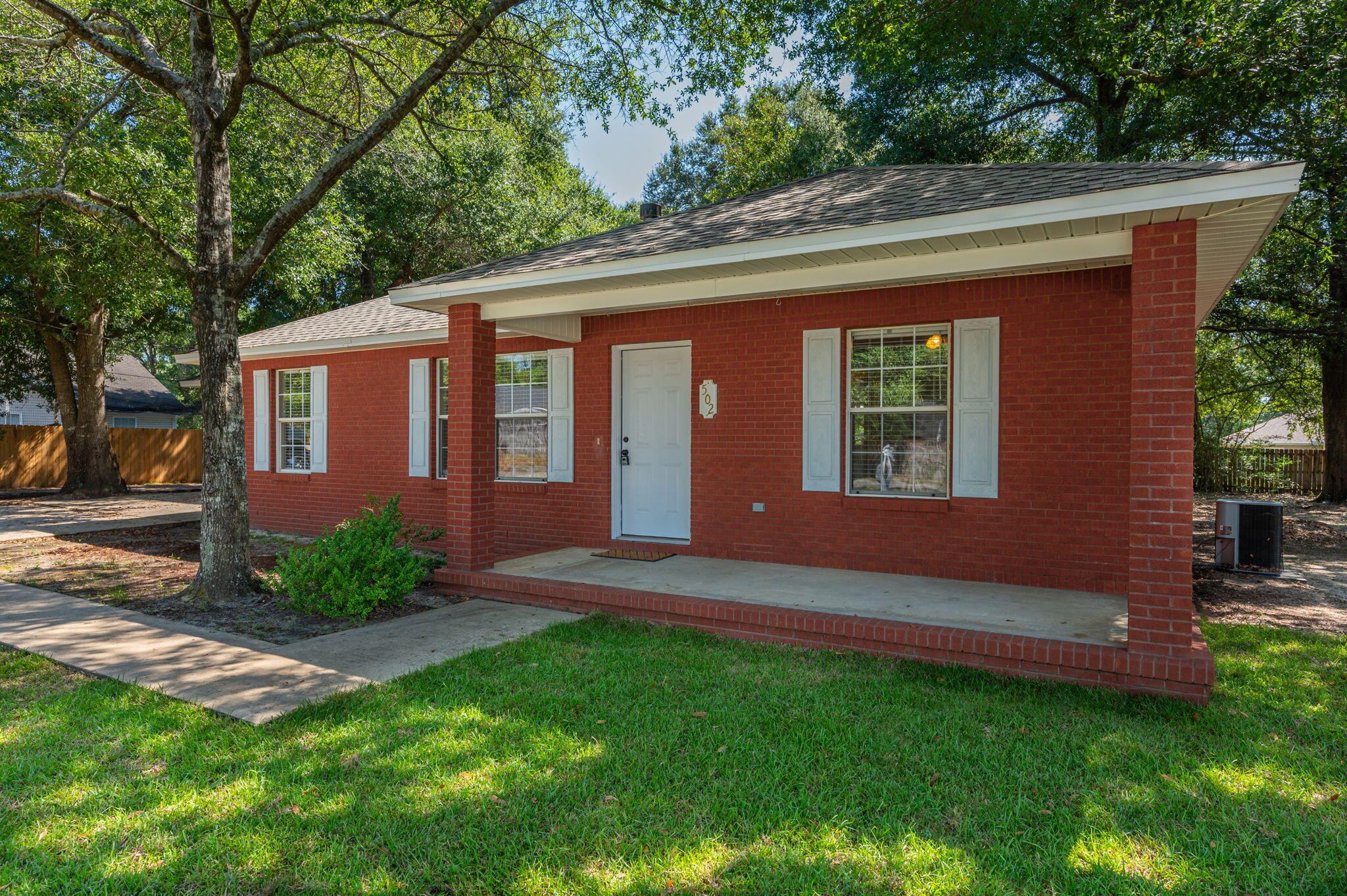 502 Hyde Park Drive Crestview, FL 32539 - Photo 3 of 35 a front view of a house with garden