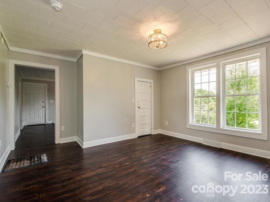 2589 Fay Jones Road Denver, NC 28037 - Photo 12 of 15 a view of an empty room with wooden floor and a window