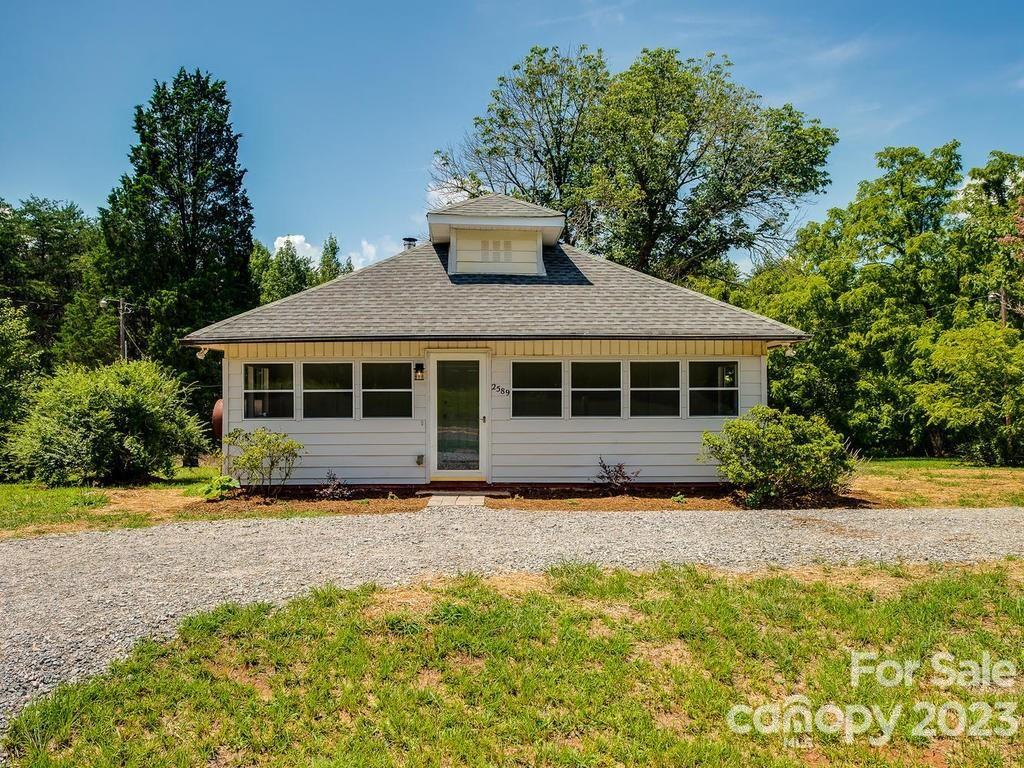 2589 Fay Jones Road Denver, NC 28037 - Photo 2 of 15 a front view of a house with a garden