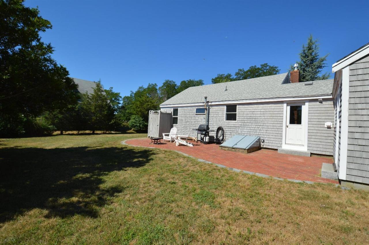 20 Sunset Lane Barnstable, MA 02630 - Photo 14 of 19 a view of a house with backyard and sitting area
