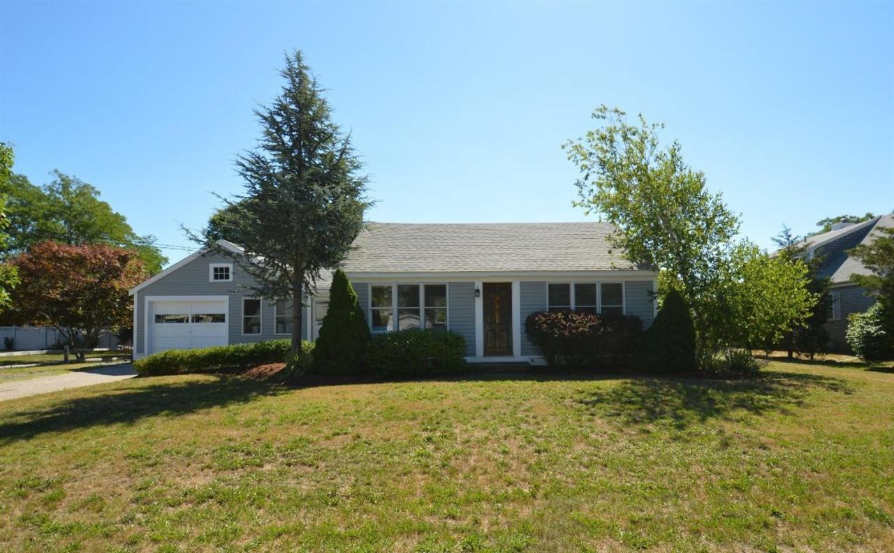 20 Sunset Lane Barnstable, MA 02630 - Photo 16 of 19 a front view of a house with a yard