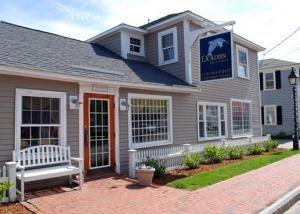 20 Sunset Lane Barnstable, MA 02630 - Photo 17 of 19 a front view of a house with a garden and plants