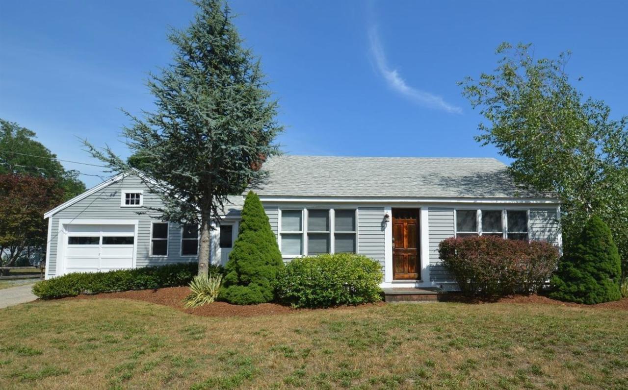 20 Sunset Lane Barnstable, MA 02630 - Photo 2 of 19 a front view of a house with yard and green space