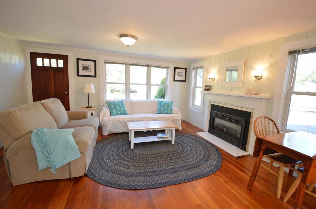 20 Sunset Lane Barnstable, MA 02630 - Photo 3 of 19 a living room with furniture and a fireplace