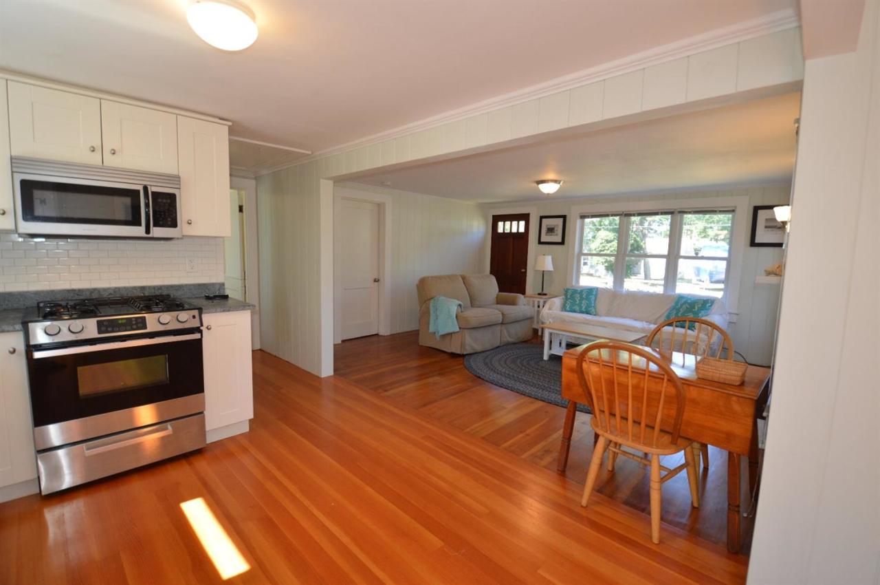 20 Sunset Lane Barnstable, MA 02630 - Photo 6 of 19 a kitchen with stainless steel appliances granite countertop a stove and a wooden floors