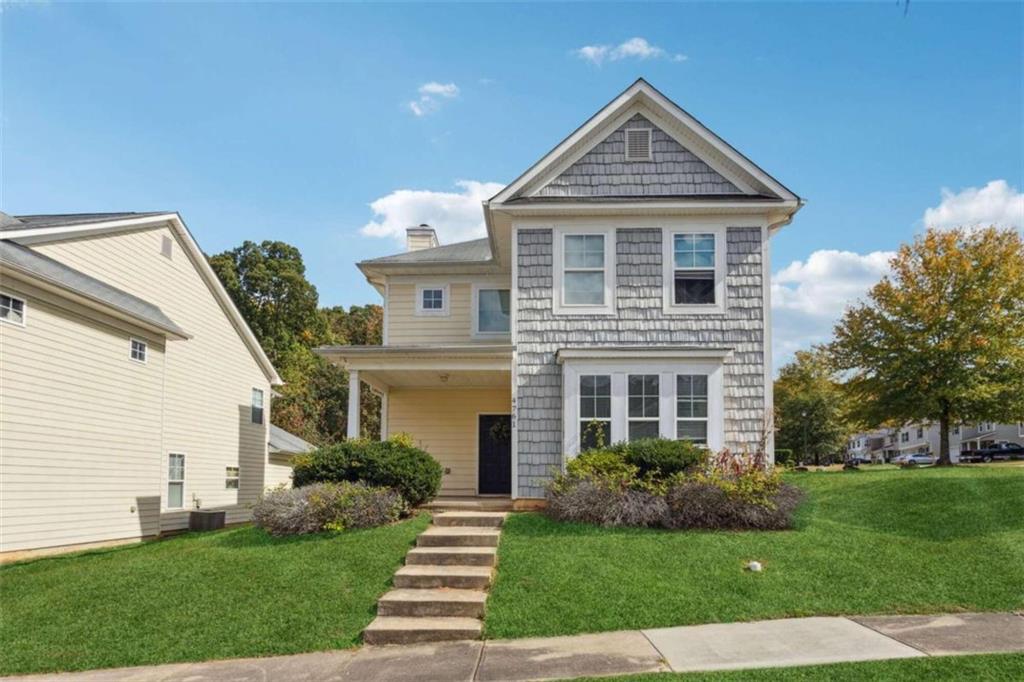 4761 Highpoint Way Atlanta, GA 30349 - Photo 1 of 1 a front view of a house with a yard