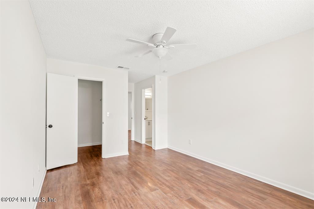 968 Espinado Avenue St. Augustine, FL 32086 - Photo 14 of 36 a view of an empty room with wooden floor