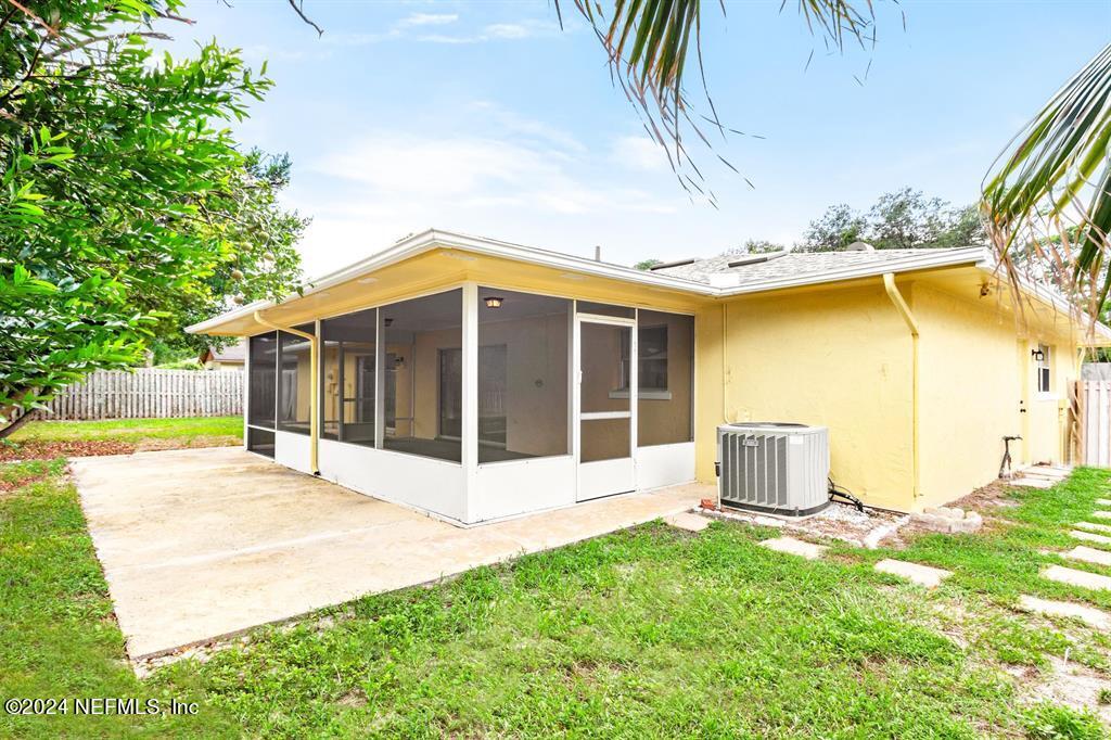968 Espinado Avenue St. Augustine, FL 32086 - Photo 25 of 36 a view of a house with a yard and sitting area