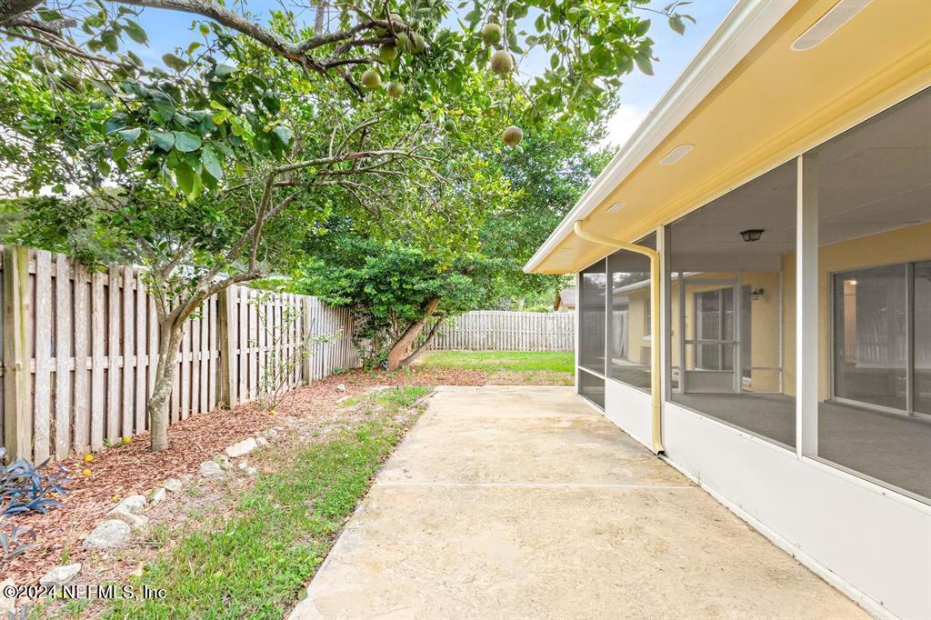 968 Espinado Avenue St. Augustine, FL 32086 - Photo 26 of 36 a view of a house with backyard and sitting area