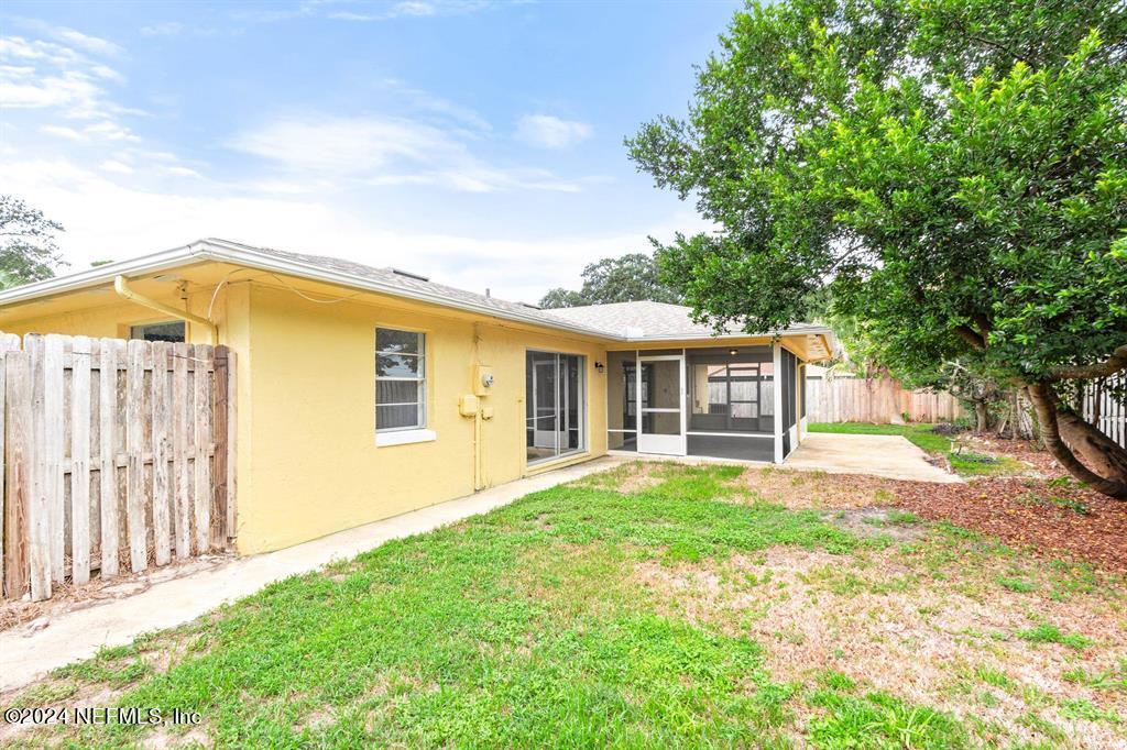 968 Espinado Avenue St. Augustine, FL 32086 - Photo 28 of 36 front view of a house with a yard