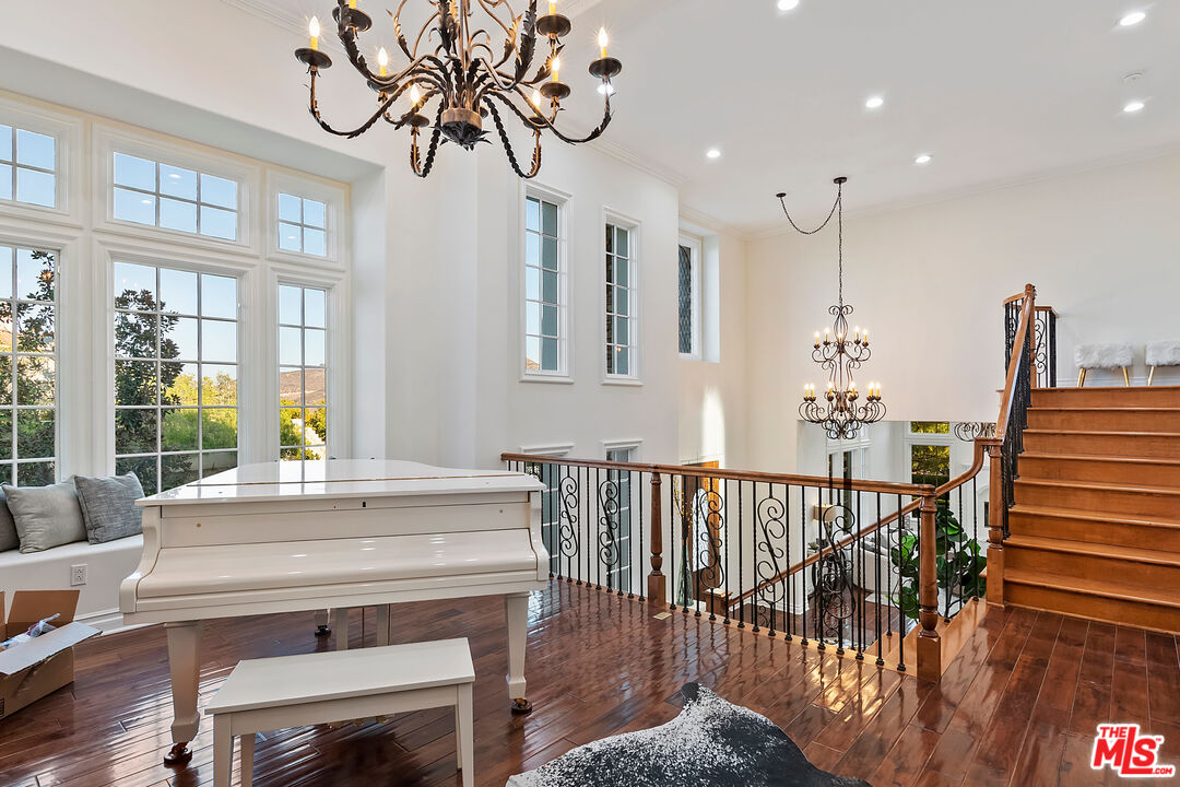 25430 Prado De Azul Calabasas, CA 91302 - Photo 15 of 51 a view of a dining room with furniture a chandelier and wooden floor