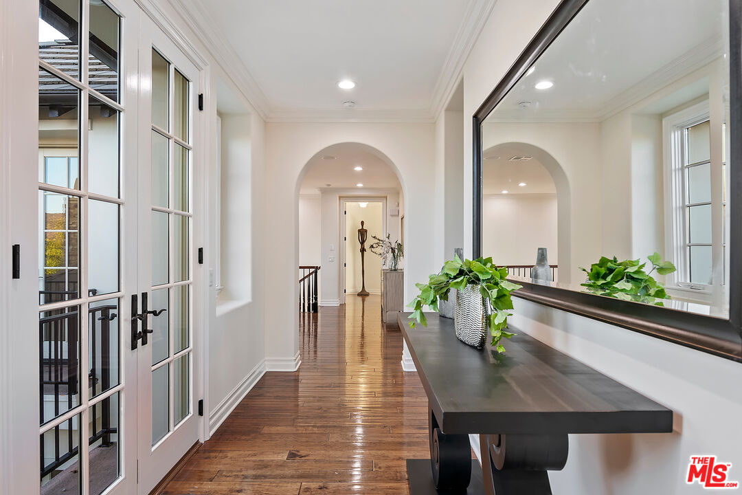 25430 Prado De Azul Calabasas, CA 91302 - Photo 17 of 51 a view of a hallway to a potted plant and furniture