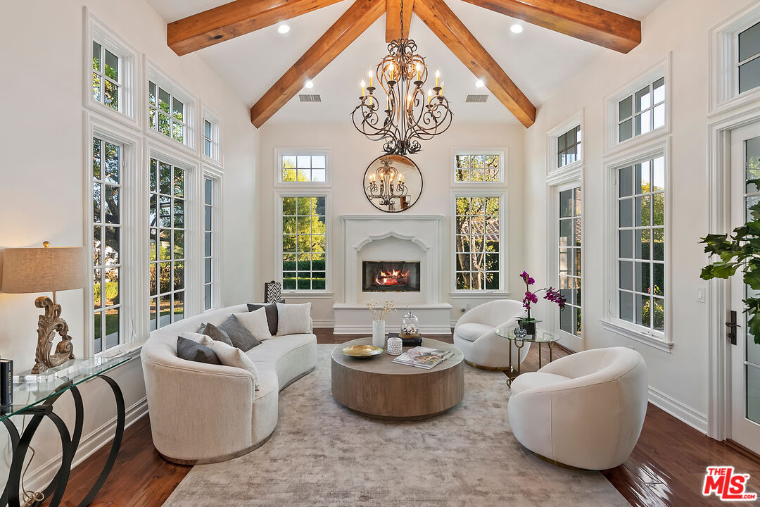 25430 Prado De Azul Calabasas, CA 91302 - Photo 3 of 51 a living room with furniture a chandelier and a large window