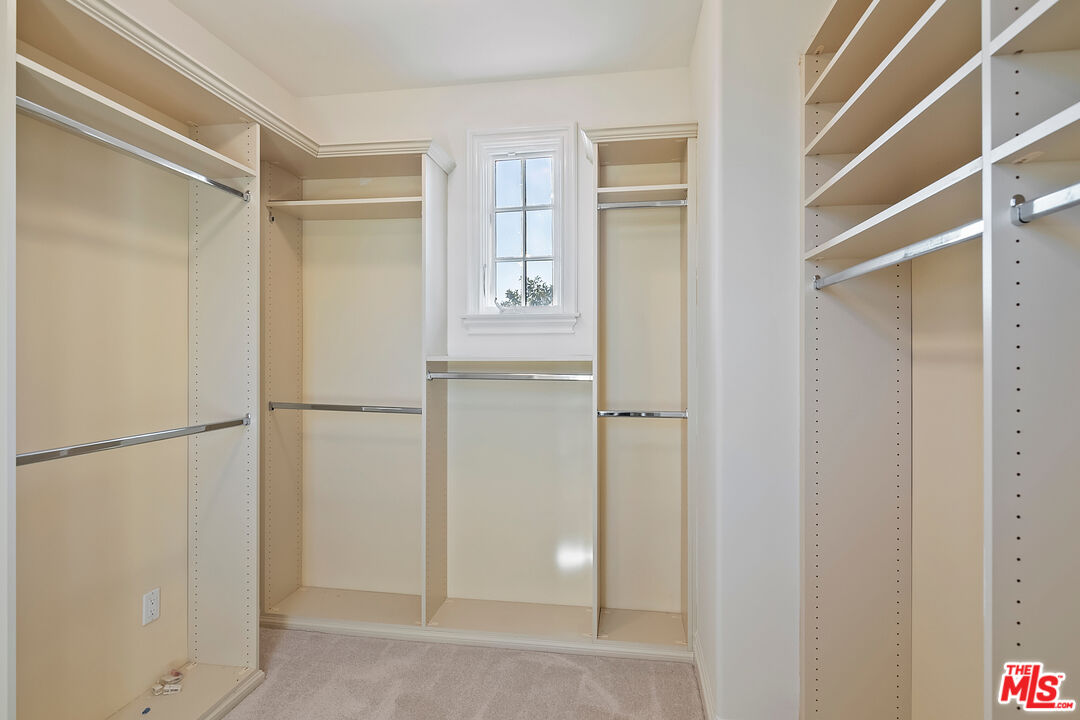 25430 Prado De Azul Calabasas, CA 91302 - Photo 26 of 51 a view of walk in closet with empty racks