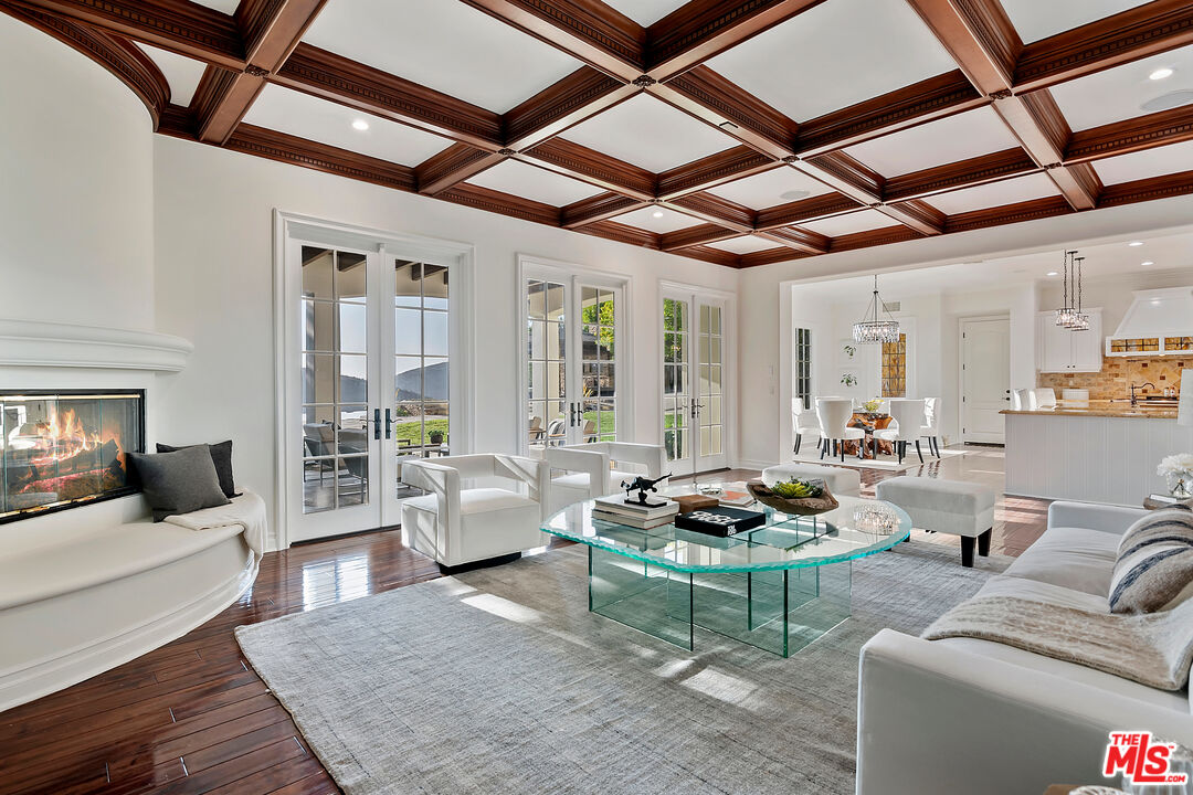 25430 Prado De Azul Calabasas, CA 91302 - Photo 4 of 51 a living room with furniture and a floor to ceiling window