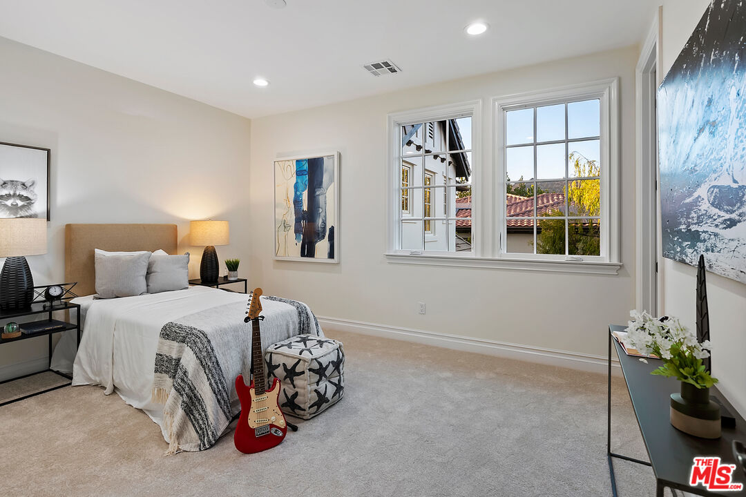 25430 Prado De Azul Calabasas, CA 91302 - Photo 31 of 51 a bedroom with bed and a window