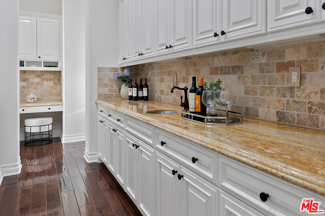 25430 Prado De Azul Calabasas, CA 91302 - Photo 8 of 51 a kitchen with kitchen island granite countertop a sink and cabinets