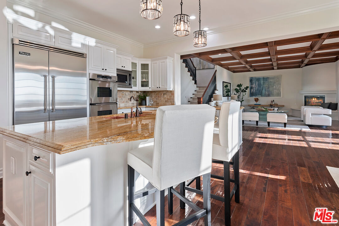 25430 Prado De Azul Calabasas, CA 91302 - Photo 9 of 51 a dining room with furniture a chandelier and wooden floor