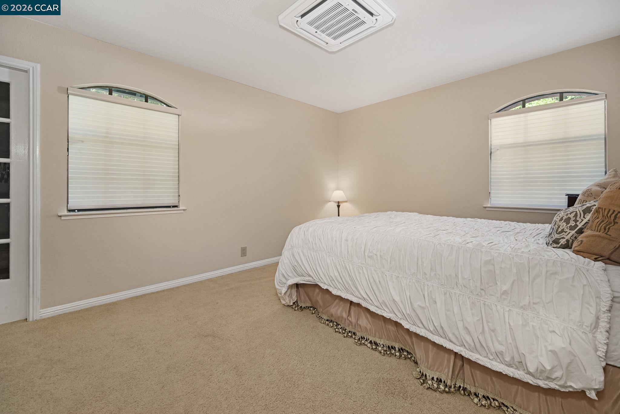 490 St Marys Road Lafayette, CA 94549 - Photo 30 of 61 a bedroom with a bed and a window