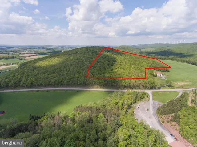 a view of a lake with a house in the background