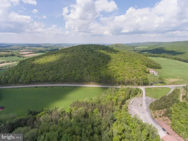 a view of a lake with a house in the background
