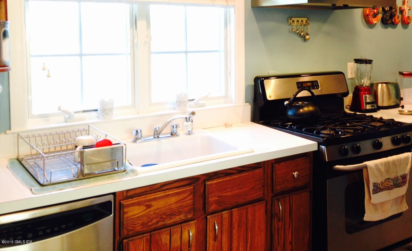 16 Orchard Street Cos Cob, CT 06807 - Photo 11 of 24 a kitchen with a sink cabinets and window