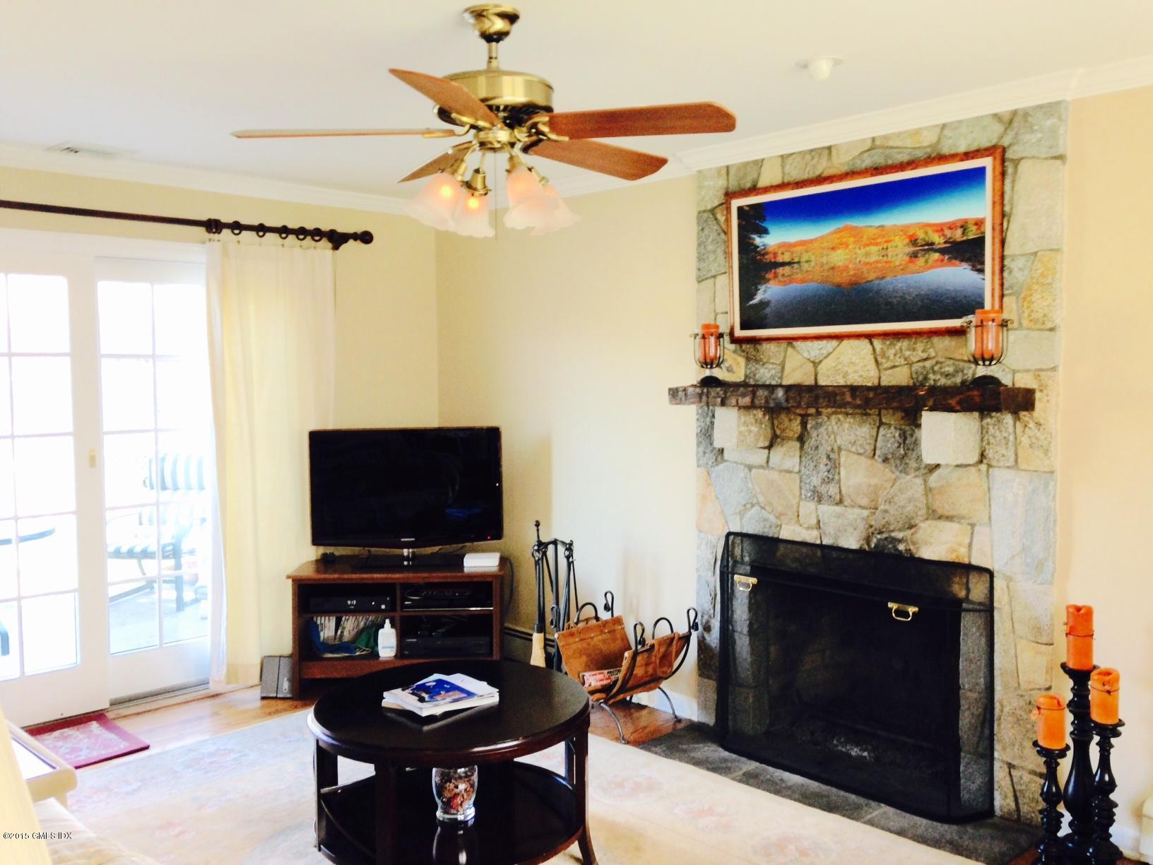 16 Orchard Street Cos Cob, CT 06807 - Photo 13 of 24 a living room with furniture and a flat screen tv