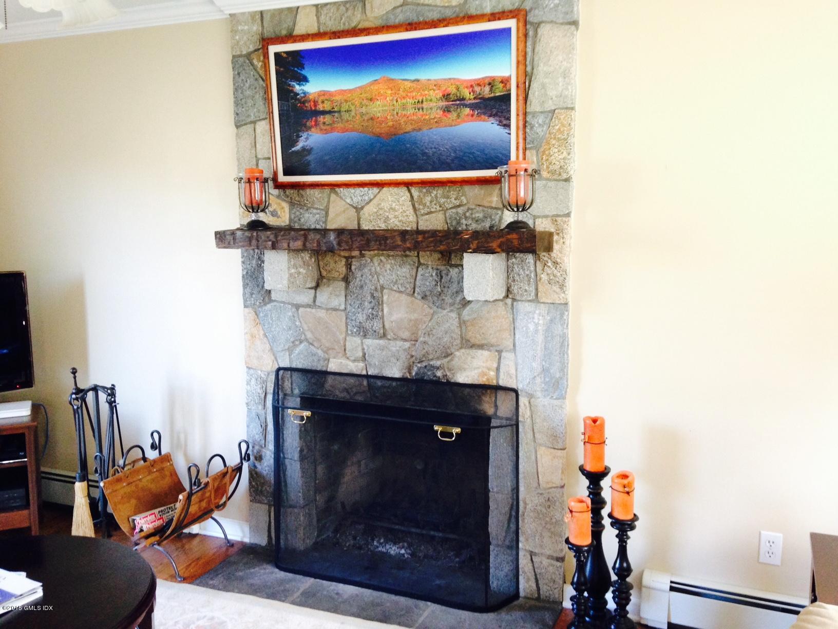 16 Orchard Street Cos Cob, CT 06807 - Photo 14 of 24 a living room with furniture and a fireplace