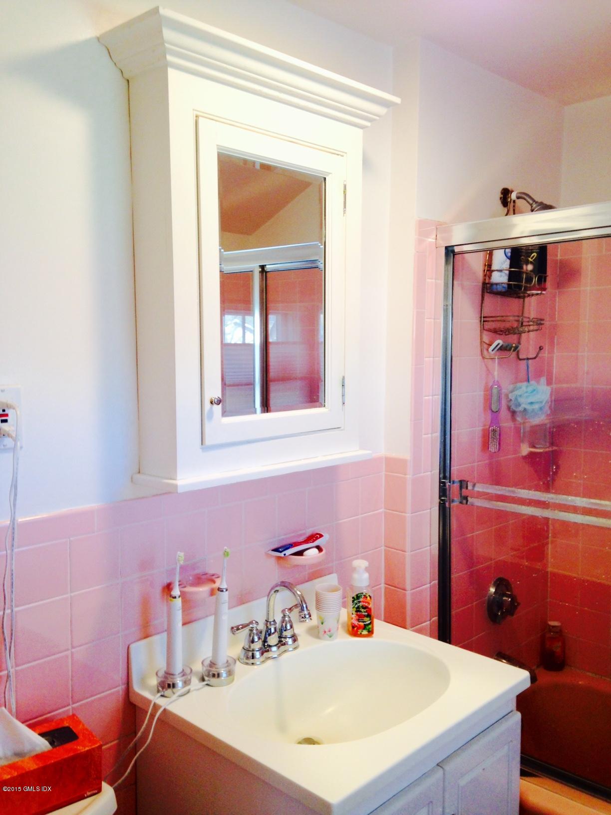 16 Orchard Street Cos Cob, CT 06807 - Photo 21 of 24 a bathroom with a sink and a mirror
