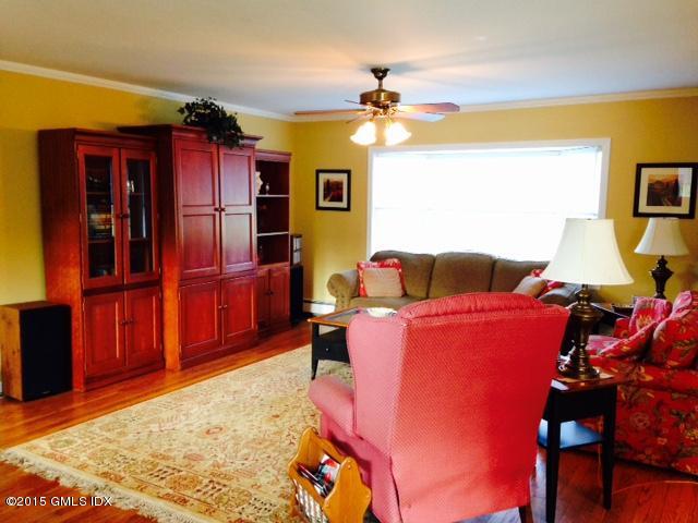 16 Orchard Street Cos Cob, CT 06807 - Photo 4 of 24 a living room with furniture and a flat screen tv
