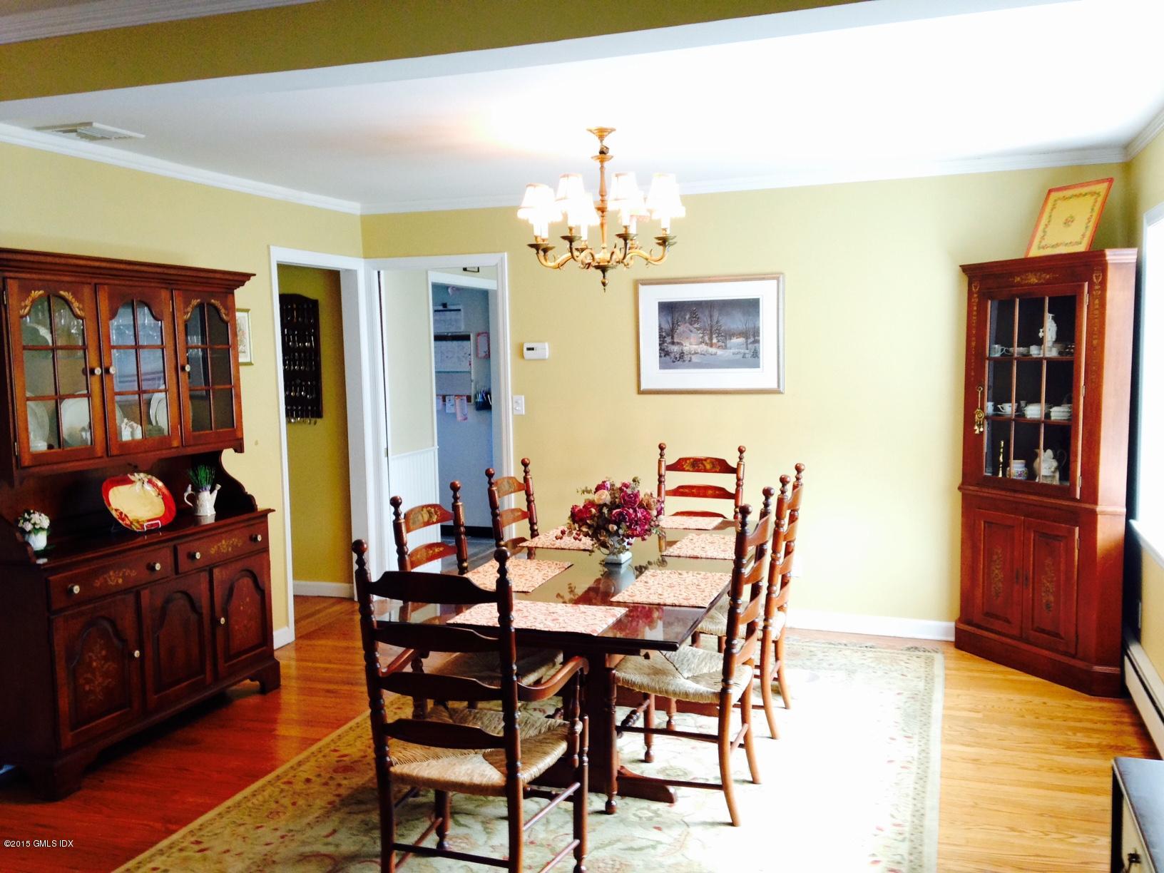 16 Orchard Street Cos Cob, CT 06807 - Photo 5 of 24 a dining room with furniture and chandelier