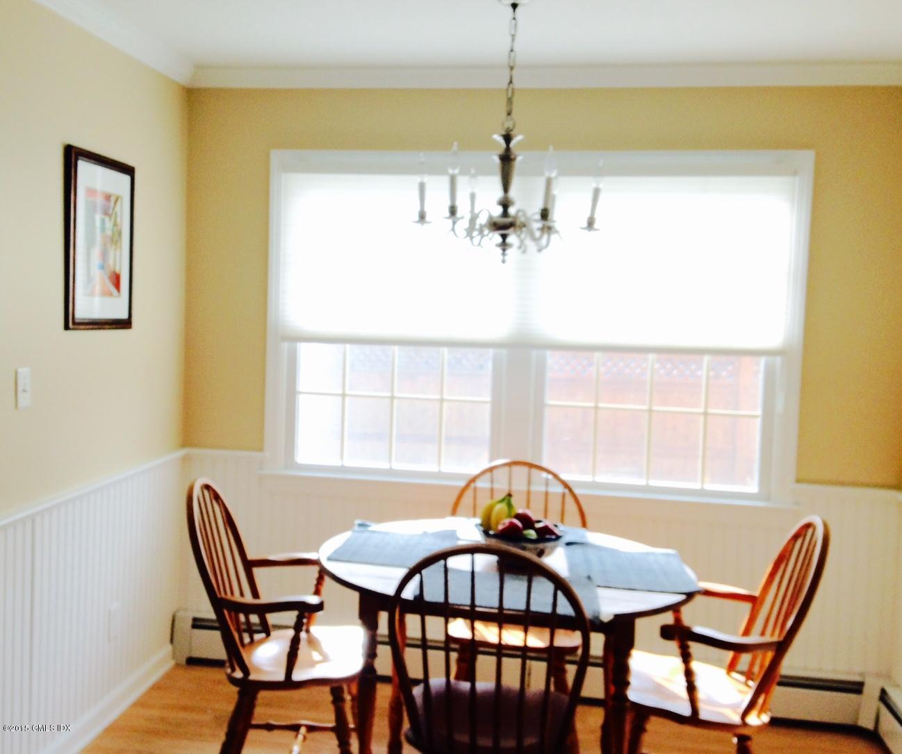 16 Orchard Street Cos Cob, CT 06807 - Photo 6 of 24 a view of a dining room with furniture and chandelier