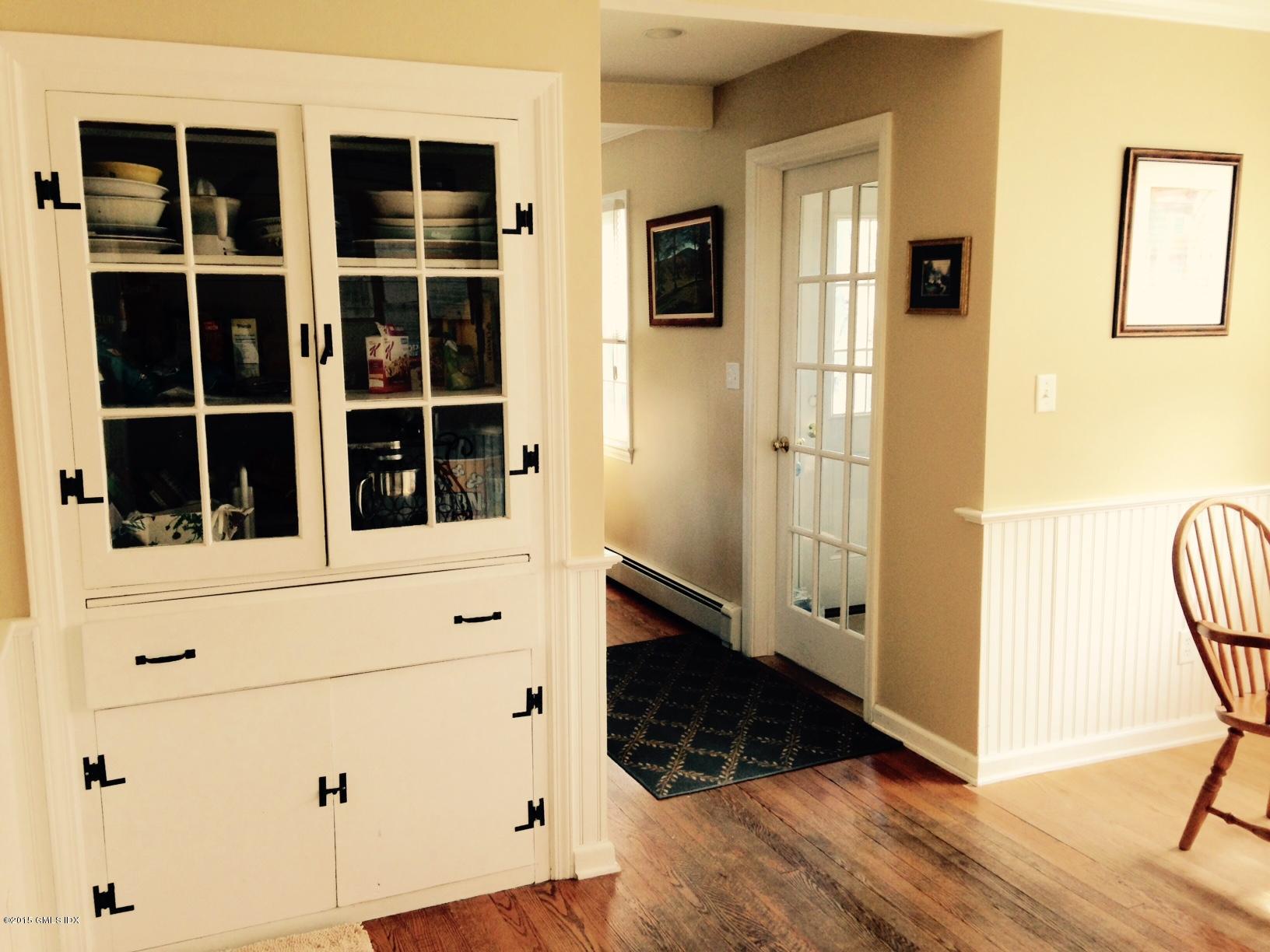 16 Orchard Street Cos Cob, CT 06807 - Photo 7 of 24 a view of closet with wooden floor