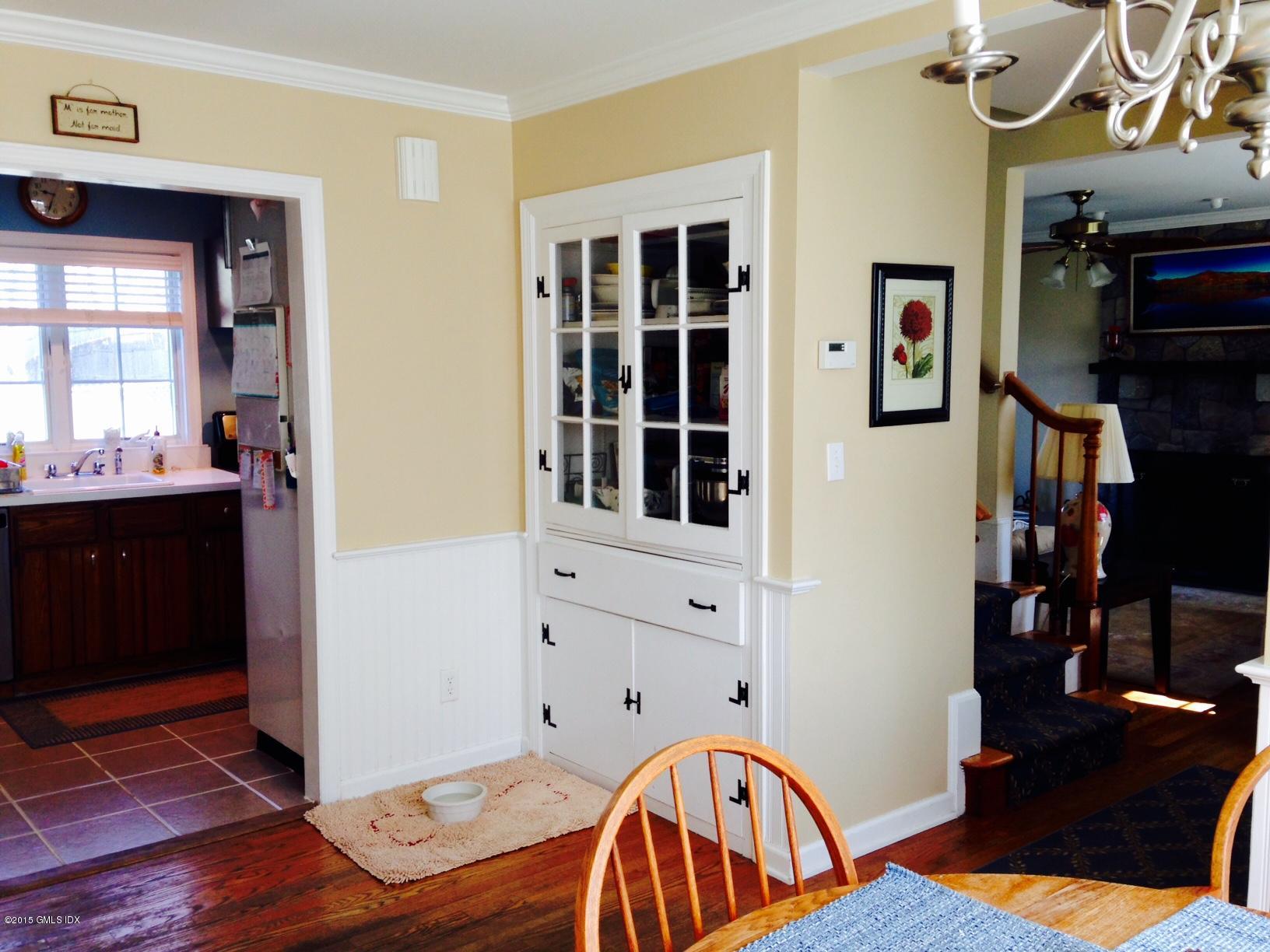 16 Orchard Street Cos Cob, CT 06807 - Photo 8 of 24 a bedroom with furniture and a window