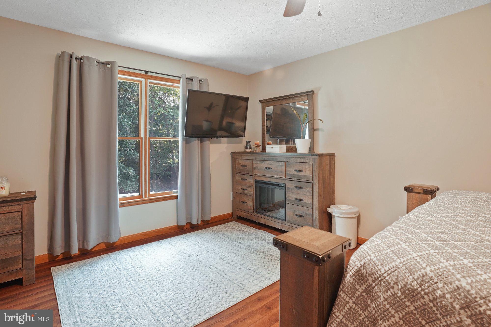 570 Conowingo Road Conowingo, MD 21918 - Photo 17 of 29 a bed room with a bed and a television